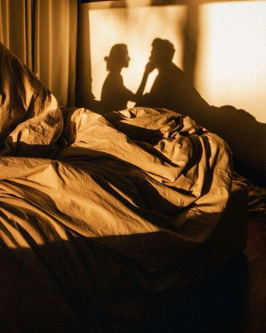 Shadow of couple in golden light